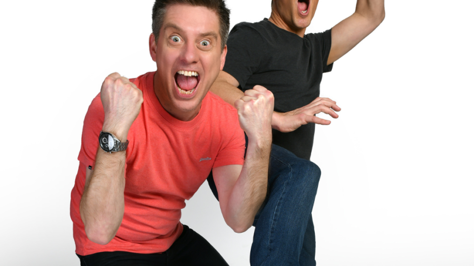 a photo of dick and dom in which Dick looks excited and Dom looks like he is falling